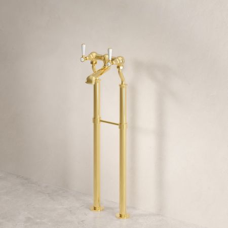 Linton Classic Floor Mounted Bath Filler With White Levers In Living Brass