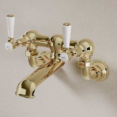 Linton Classic Wall Mounted Bath Filler with White Levers in Timeless Brass
