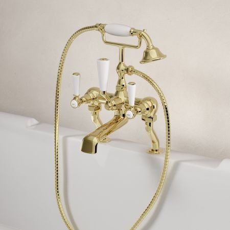 Linton Classic Deck Mounted Bath Shower Mixer with White Levers in Timeless Brass