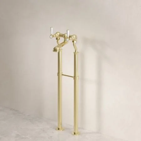 Linton Classic Floor Mounted Bath Filler with 725mm Standpipes & White Levers in Timeless Brass